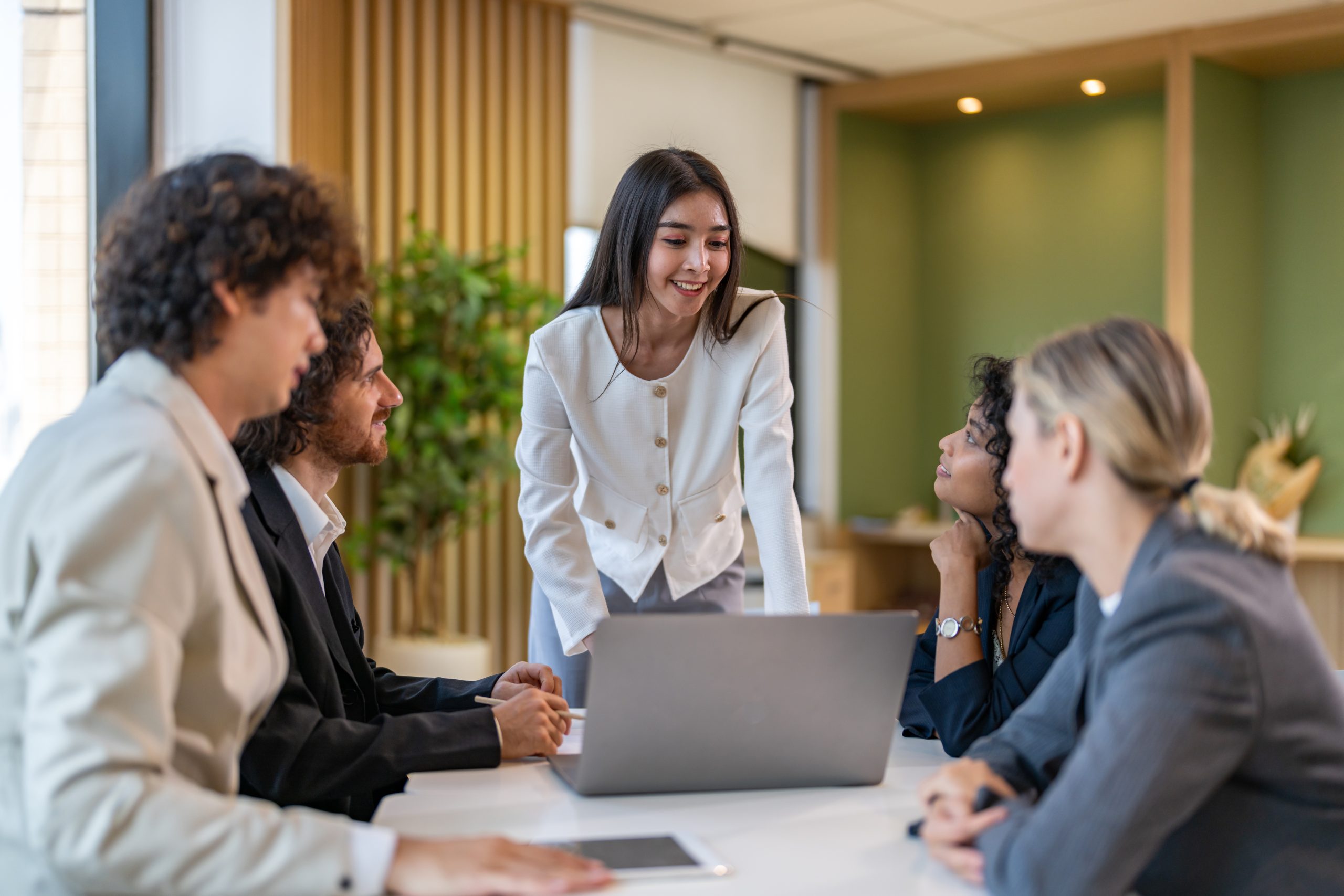Leadership training, executive communication and team development in progress with diverse professionals in coaching seminar, strategic thinking and interpersonal skills in a modern workplace